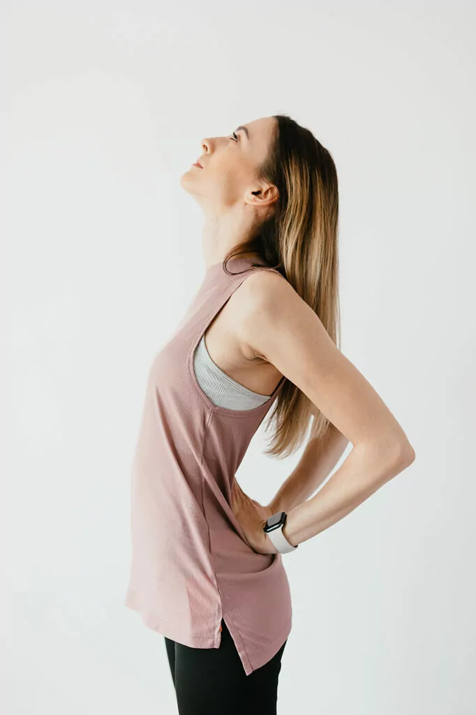 woman performing gentle stretch in upper body with starting position