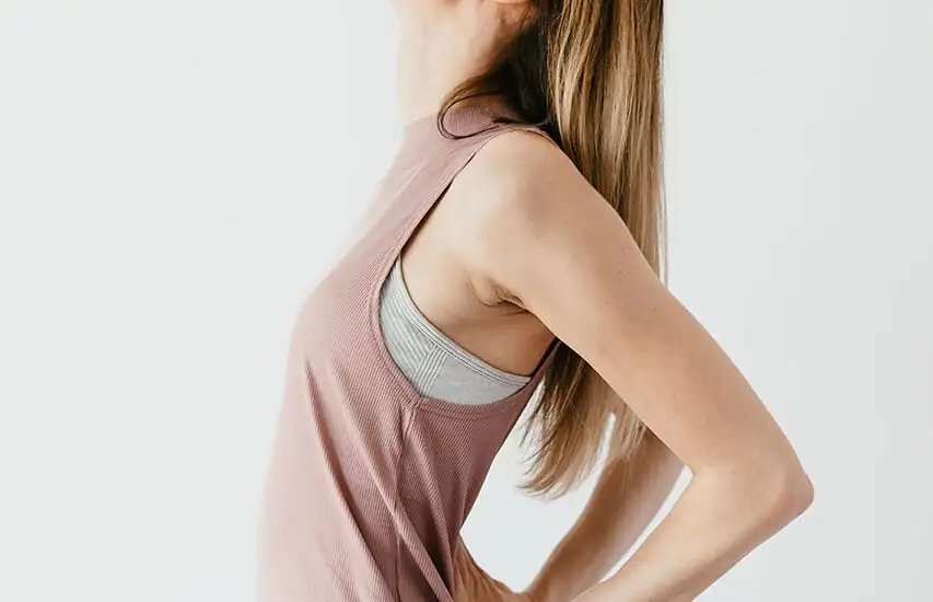 woman performing gentle stretch in upper body with starting position