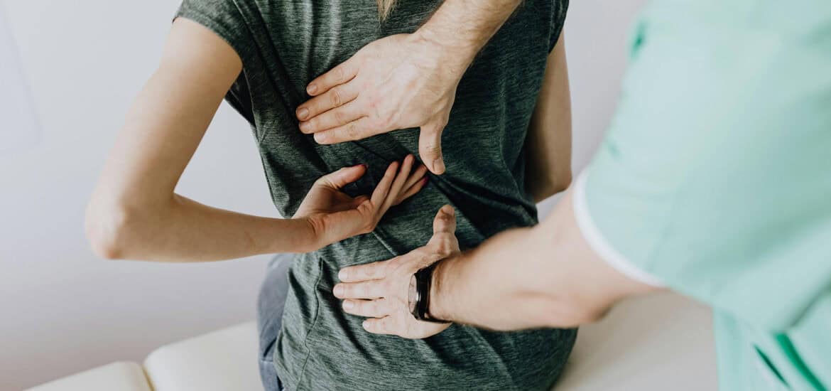 person being examined for pinched nerves from herniated disk