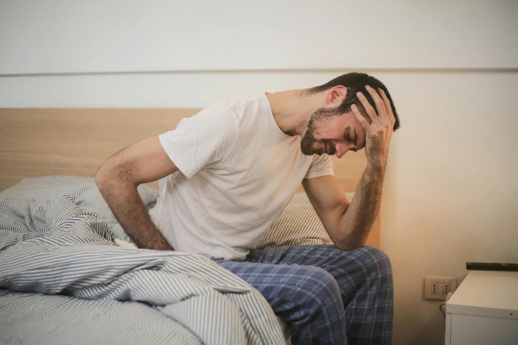 man with pinched nerves seeking help from pain specialist